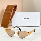 Cat-eye sunglasses with amber lenses and gold-tone frame, black temple detail