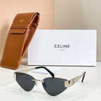 Cat-eye sunglasses with dark-tinted lenses and gold-tone frame details