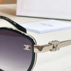 Celine gold-tone sunglasses temple with logo near hinge and dark lens