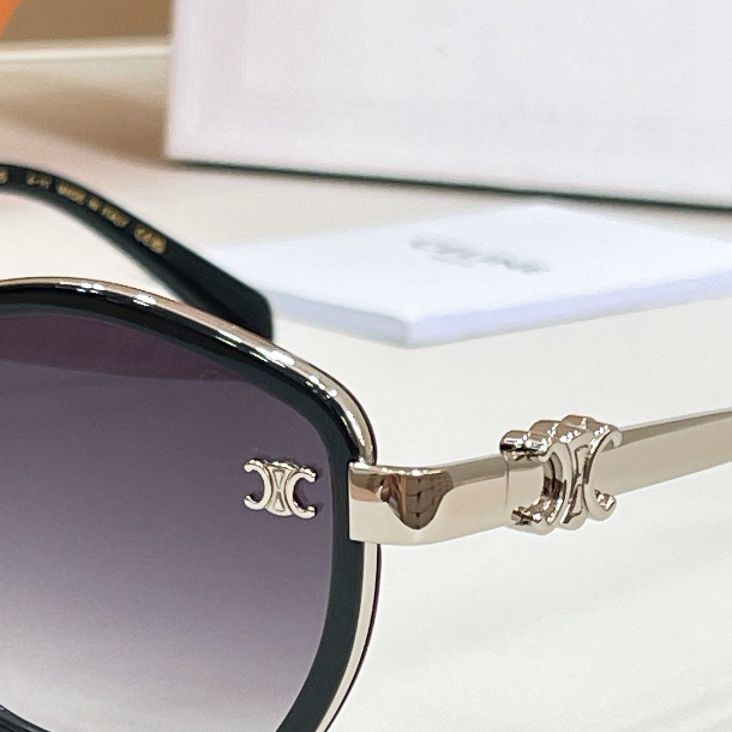 Celine gold-tone sunglasses temple with logo near hinge and dark lens