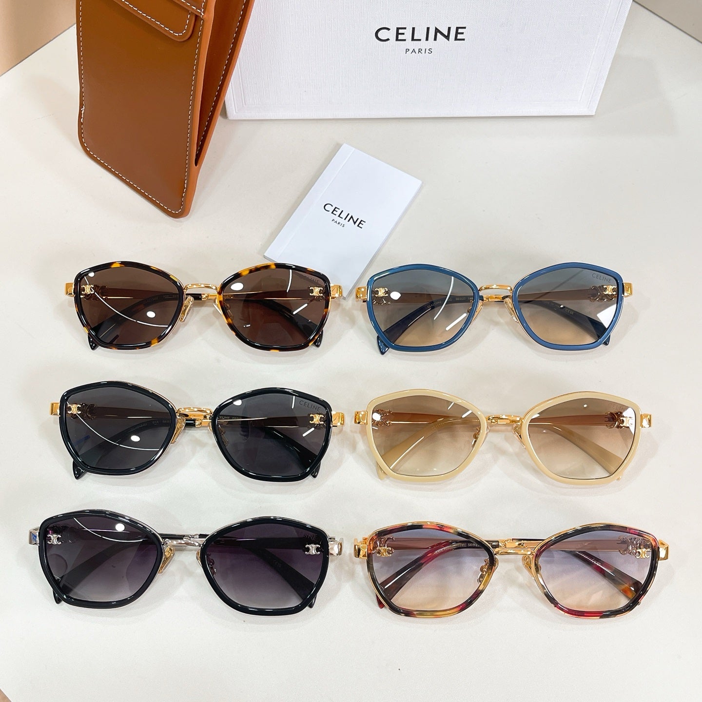 Celine sunglasses assortment with mixed frames, including black, blue, tan, and tortoise