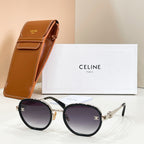 Round sunglasses with dark lenses, black frame, and silver-tone temple logo emblem