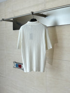 White cable-knit polo shirt back view with short sleeves