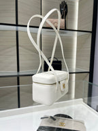 White Chanel mini handbag with long straps and gold CC charm