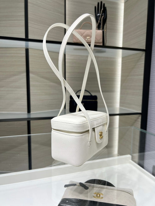 White Chanel mini handbag with long straps and gold CC charm