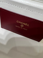 White Chanel handbag interior label reading CHANEL and MADE IN ITALY