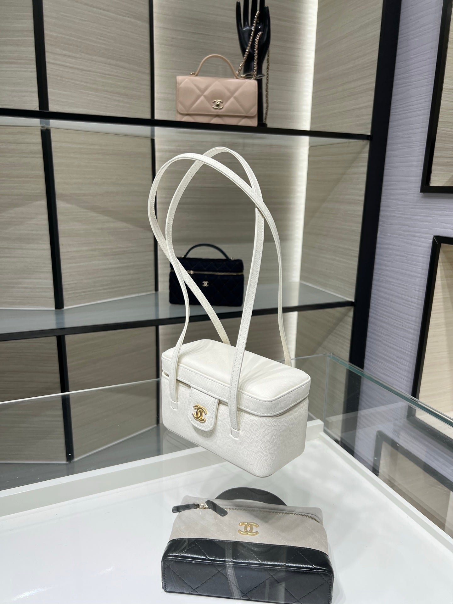 White Chanel mini handbag with top handles and gold CC medallion