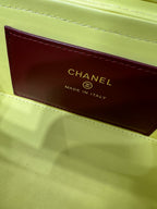 Yellow handbag interior label reading CHANEL MADE IN ITALY