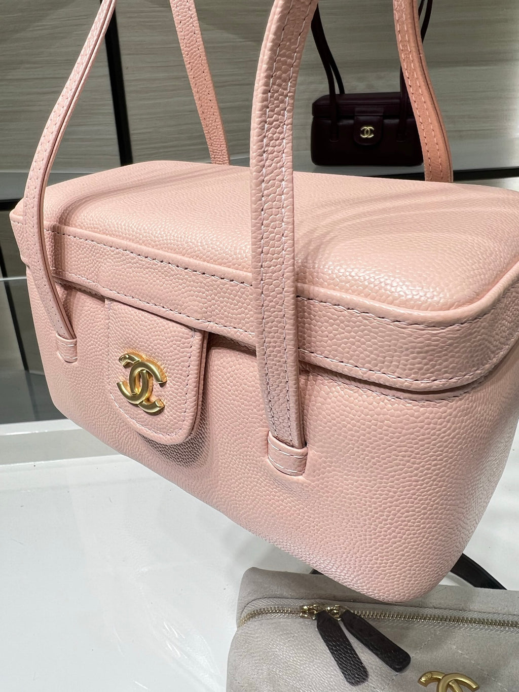 Chanel light pink textured mini bag with front flap, side buckle, and gold hardware