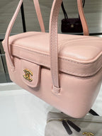 Chanel light pink textured mini bag with front flap, side buckle, and gold hardware