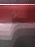 Chanel bag interior label reading CHANEL and MADE IN ITALY on burgundy lining
