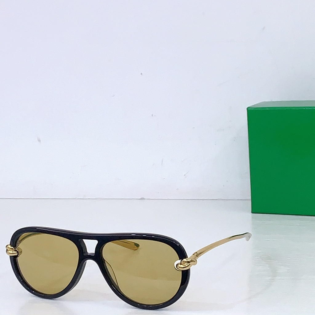Bottega Veneta sunglasses, dark frames with yellow lenses and gold-tone hinges