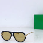 Bottega Veneta sunglasses, dark frames with yellow lenses and gold-tone hinges