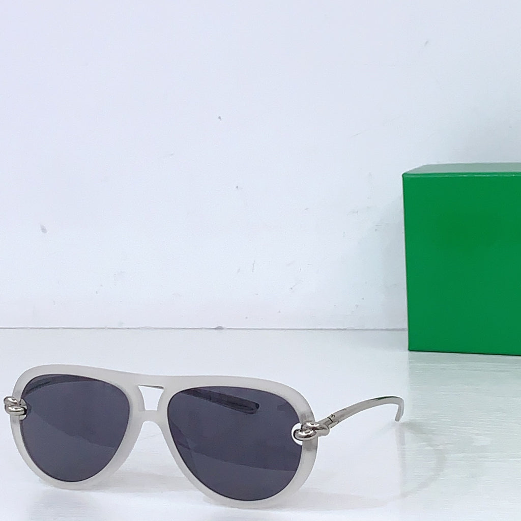 Bottega Veneta sunglasses, light gray frames with dark lenses and gold-tone hinges