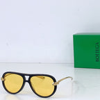 Bottega Veneta sunglasses, dark frames with bright yellow lenses and gold-tone hinges