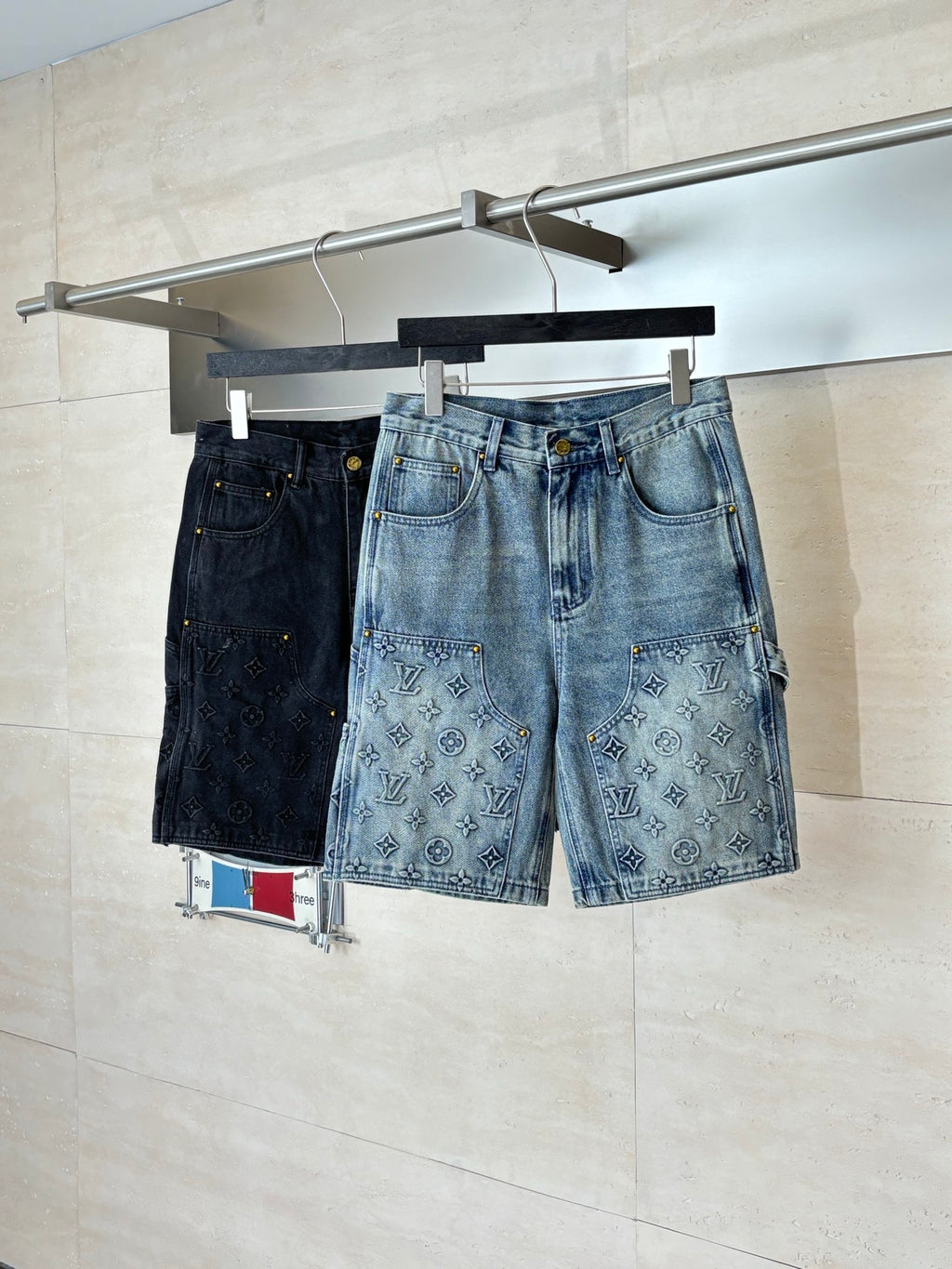Denim shorts with monogram-print front pockets and dark topstitching