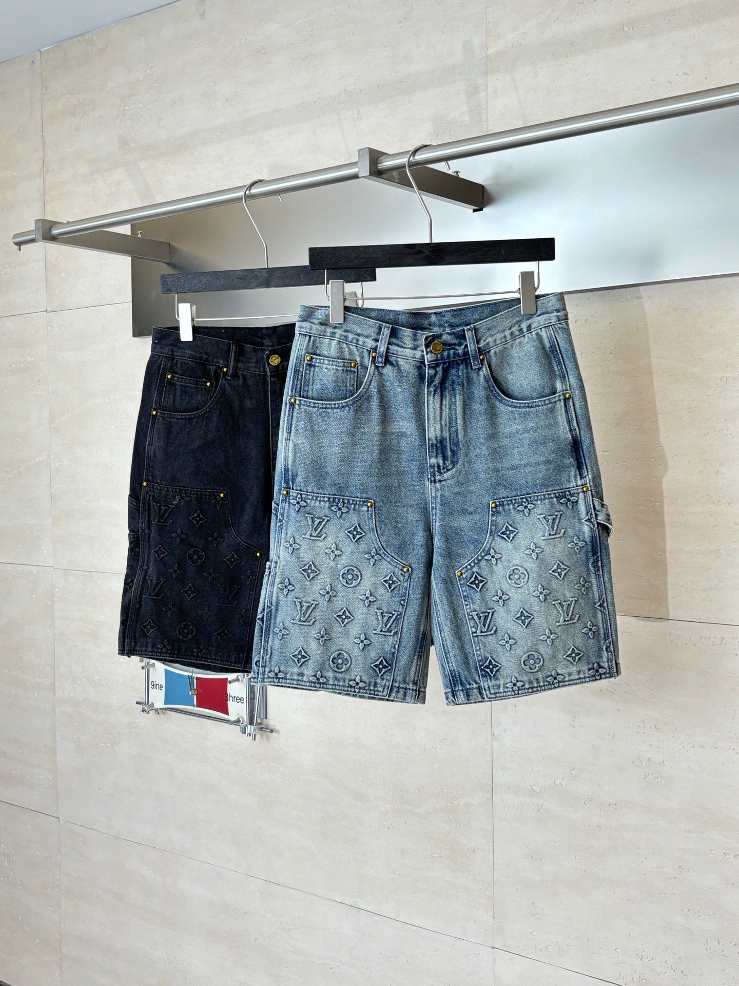Denim shorts with monogram-print front pockets and dark topstitching