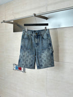 Light blue denim shorts with flap pockets and allover monogram-print design