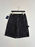 Dark denim Louis Vuitton monogram shorts, laid flat with front closure and pockets