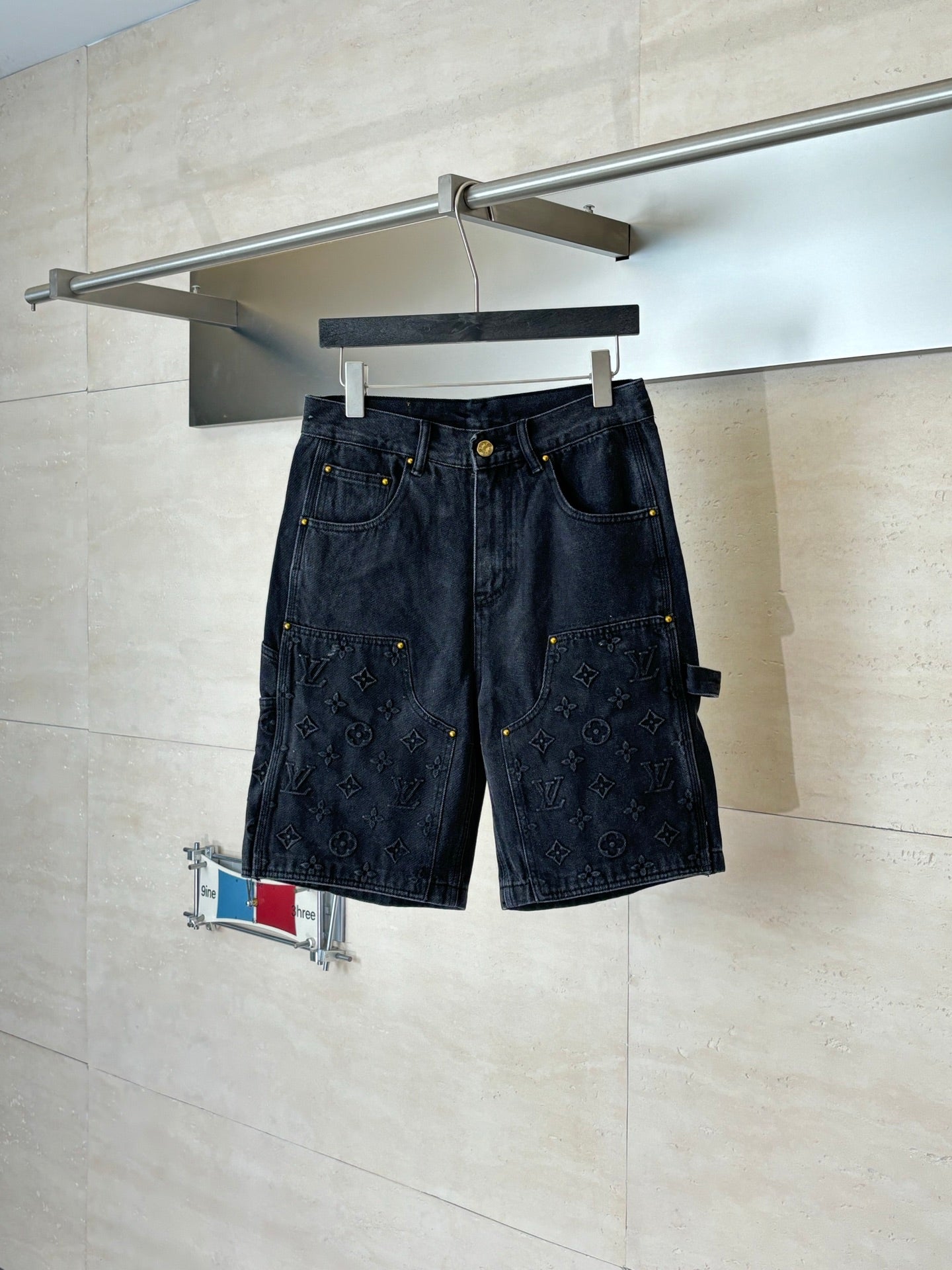 Dark denim Louis Vuitton monogram shorts, front pockets and belt loops