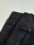 Dark denim pants with scattered Louis Vuitton monogram pattern