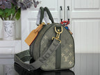Louis Vuitton monogram tote bag with dark green strap and tan leather luggage tag