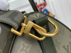 Louis Vuitton tote bag hardware close-up: gold rings, clasp, and dark green handle