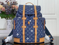Louis Vuitton monogram canvas backpack with tan leather trim and top handle