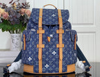 Louis Vuitton monogram canvas backpack with tan leather trim and top handle