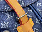 Tan leather strap with yellow stitching and metal clasp on Louis Vuitton monogram fabric