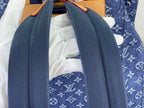 Louis Vuitton monogram backpack with dark blue shoulder straps and white interior lining