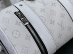 Close-up: white Louis Vuitton monogram bag strap and black zipper with silver pull
