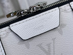 White leather bag zipper detail with embossed monogram and hardware