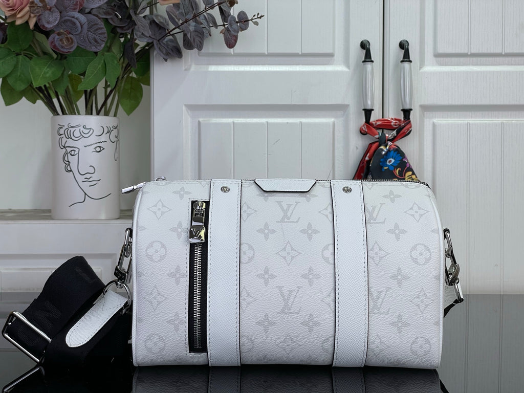 White Louis Vuitton monogram duffel bag with top handles and zip closure