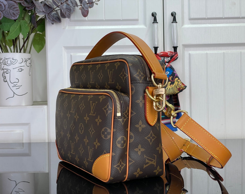 Louis Vuitton monogram small bag with tan leather handles and crossbody strap