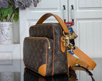 Louis Vuitton monogram small bag with tan leather handles and crossbody strap