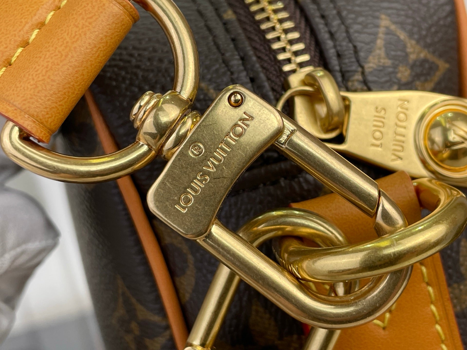 Louis Vuitton monogram bag D-ring and gold-tone hook with tan leather strap