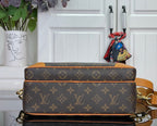 Louis Vuitton monogram bag with tan top edge and strap attachment hardware
