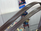 Dark leather crossbody strap with decorative edge stitching