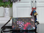 Floral monogram crossbody bag with adjustable dark leather strap