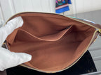 Crossbody bag interior with brown lining and gold zipper trim
