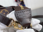 Louis Vuitton logo patch on leather strap with gold ring and clasp