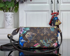 Floral monogram crossbody bag with top zip and gold-tone hardware