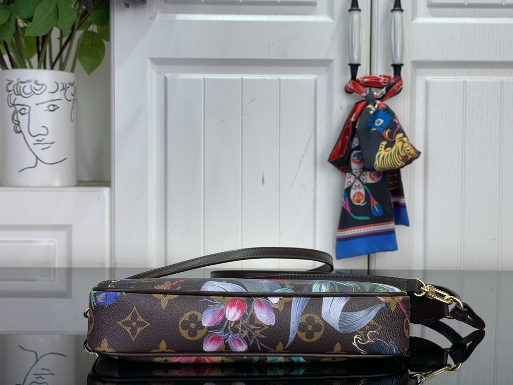 Floral monogram crossbody bag with top zip, slim handle, and strap