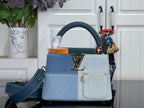 Louis Vuitton two-tone satchel bag with blue denim-look leather and gold LV clasp