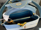 Open two-tone mini handbag with zipper closure and gold chain strap hardware