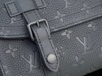 Louis Vuitton monogram bag close-up with dark hardware and embossed strap detail