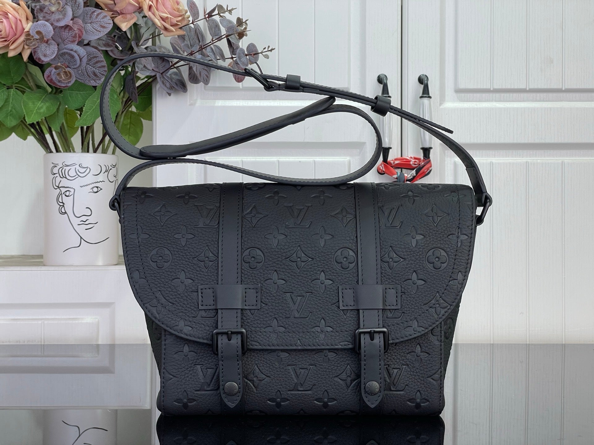Louis Vuitton satchel bag in dark navy with embossed monogram and top handles