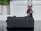 Louis Vuitton satchel bag in dark navy with front buckles and wide top handles