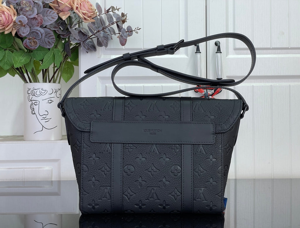 Louis Vuitton shoulder bag in dark navy with front flap pocket and adjustable strap